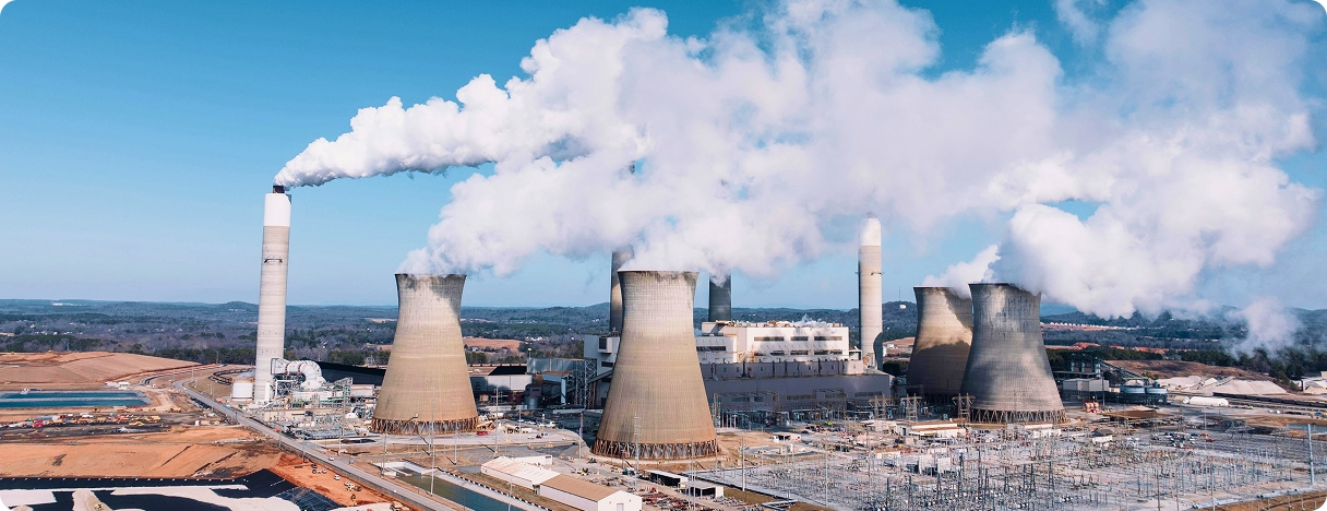 Power plant with cooling towers and smoke