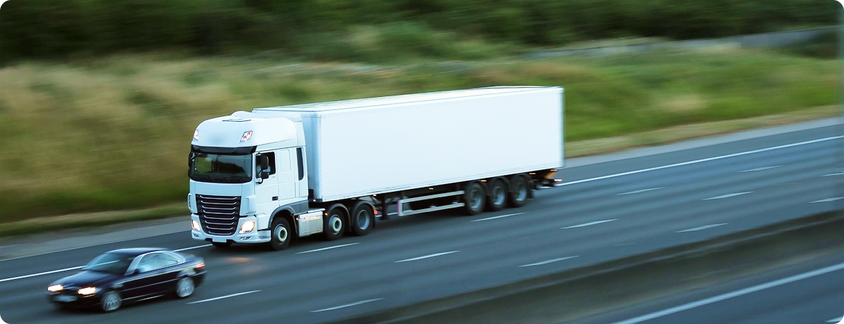 White truck on highway, motion blur