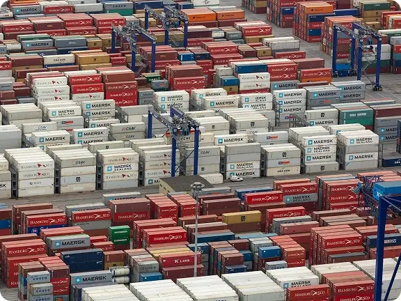 Colorful shipping containers stacked densely